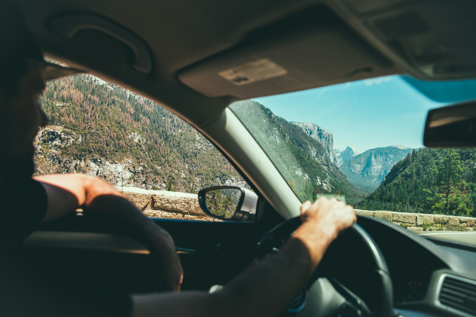 smiling man while driving, car
